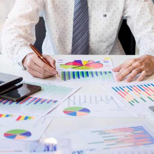 working-process-startup-businessman-working-wood-table-with-new-finance-project-modern-notebook-table-pen-holding-hand_1423-69